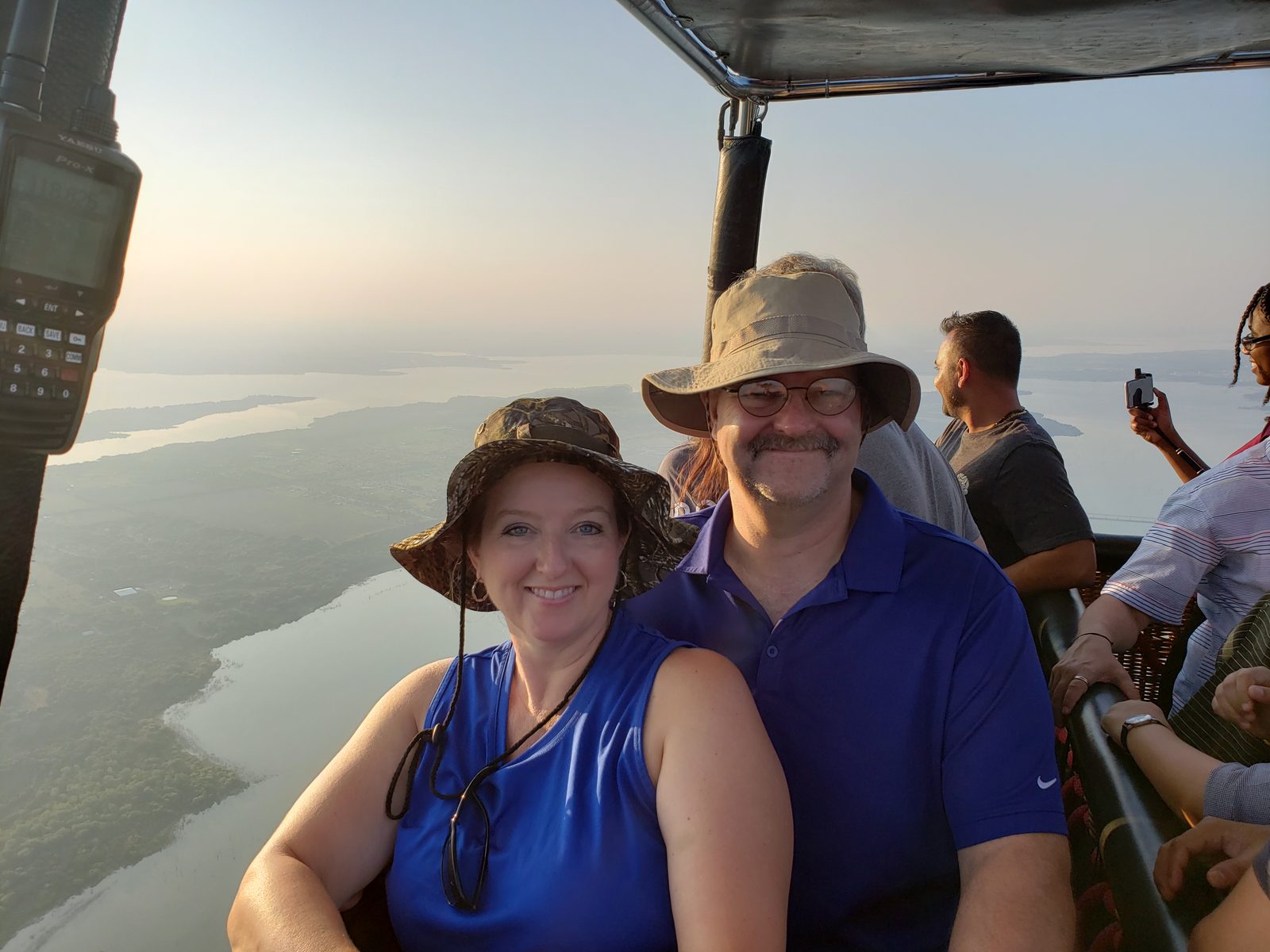 Passengers aloft in the shared basket over a North Texas lake