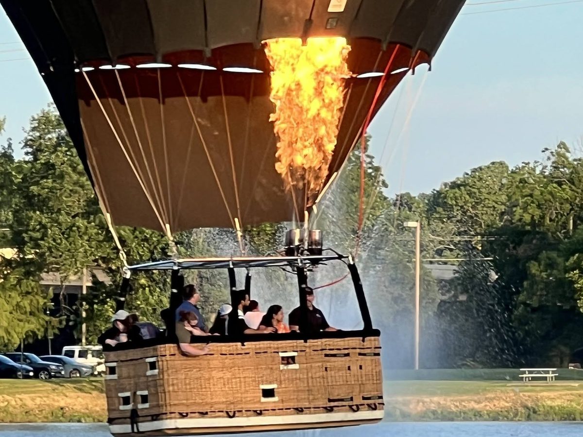 Rohr Balloons shared flight skimming a pond during a splash-and-dash with a full basket of passengers