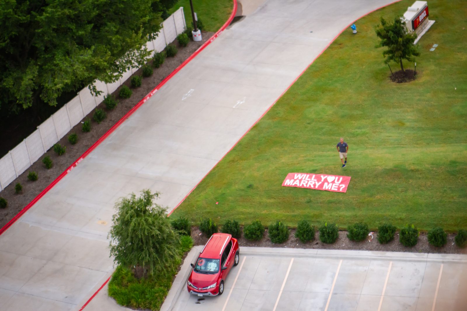 “Will You Marry Me?” banner laid out on the grass, seen from a Rohr Balloons flight overhead