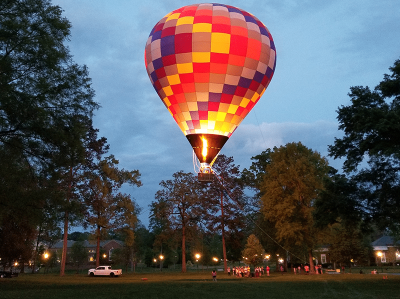 Rohr Balloons tethered balloon glowing at dusk at a private event